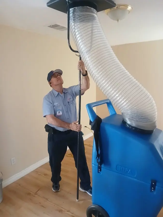 Furnace Tune-Up technician using HEPA equipment in Auburn Hills